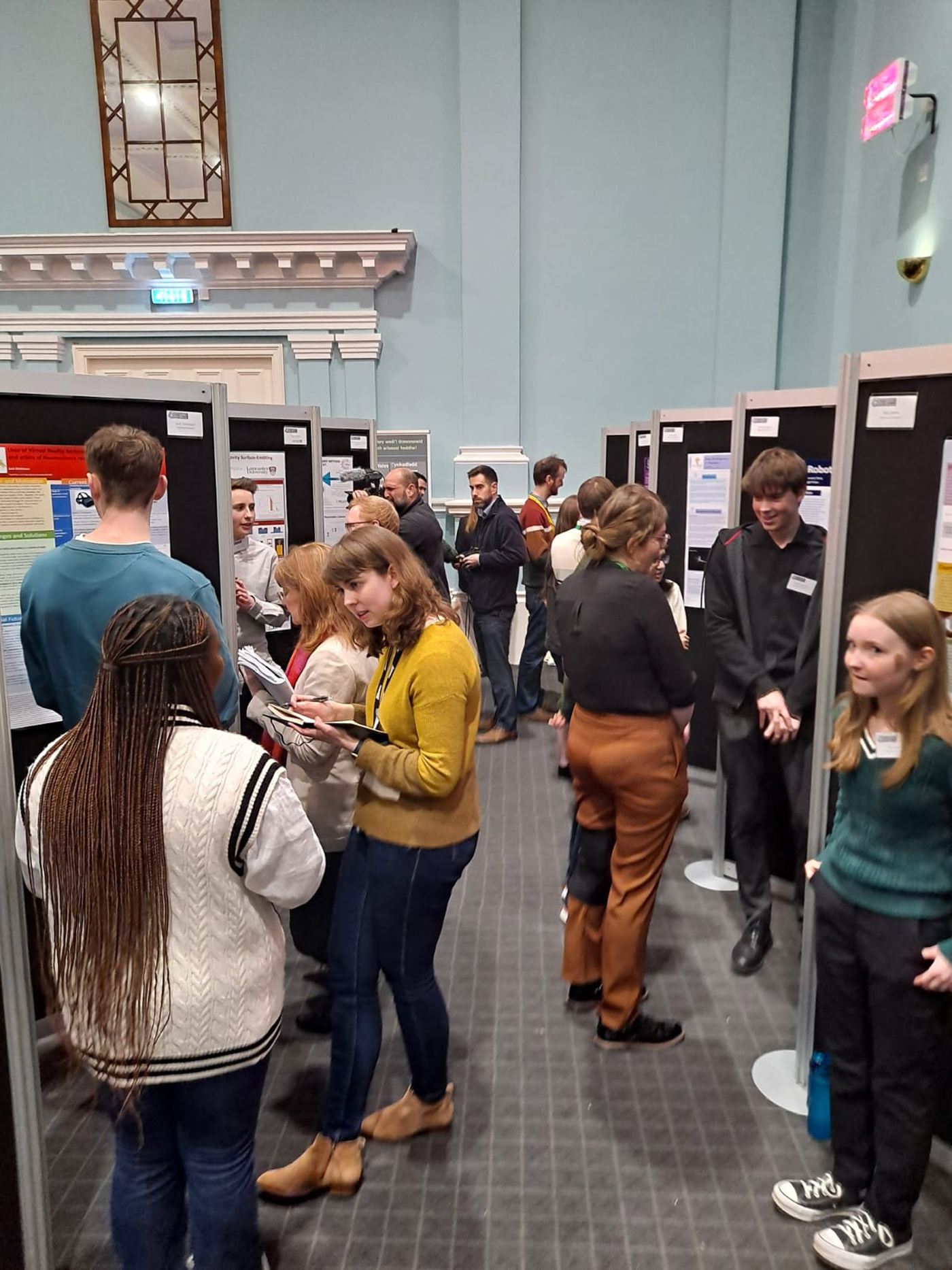 The finalists show their research to members of the public and to the judging panel