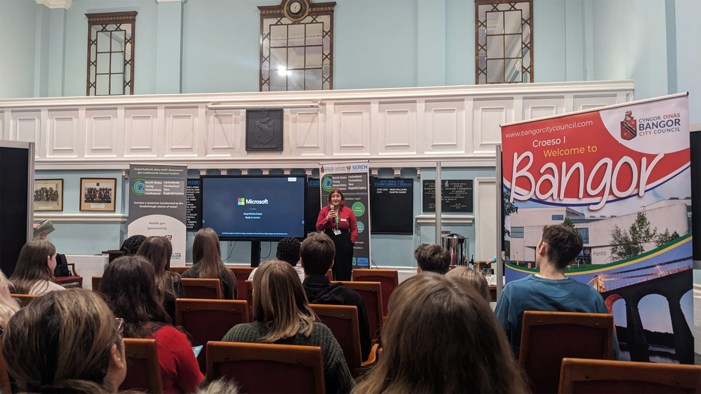 Laura Hanks Senior Researchers from Lancaster University announces the winners on Bangor University’s Pontio building.